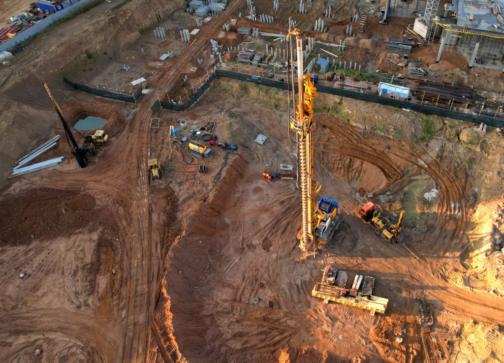 aerial view of geotechnical work site with equipment and dirt field