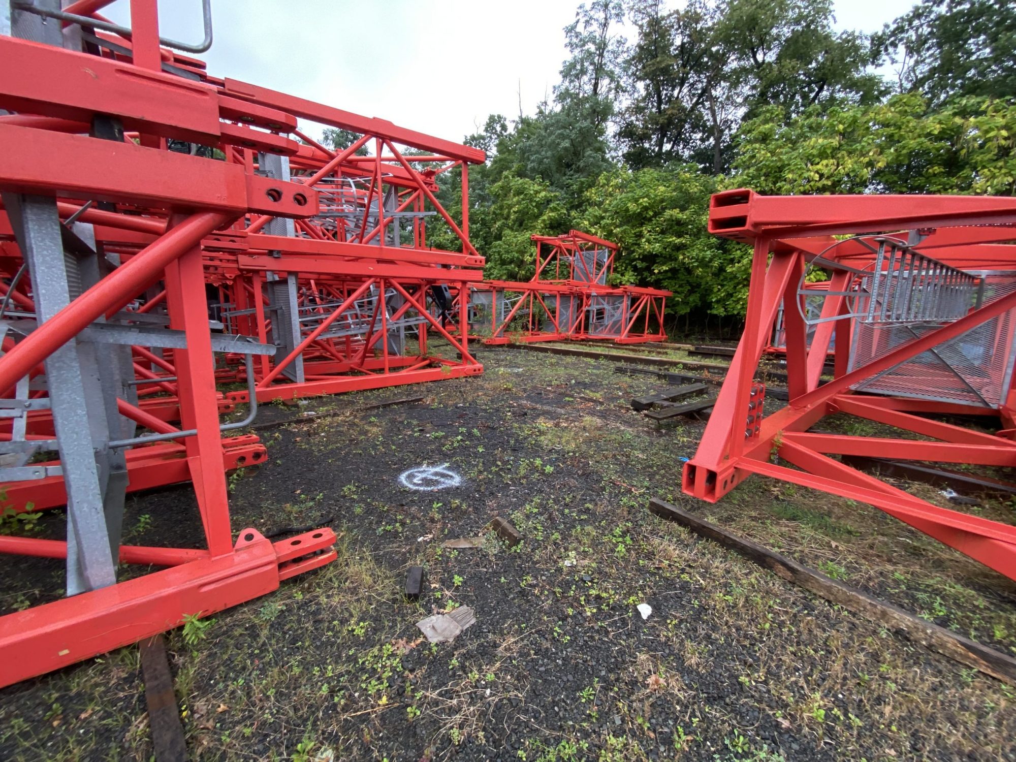 red steel structures lying on the ground