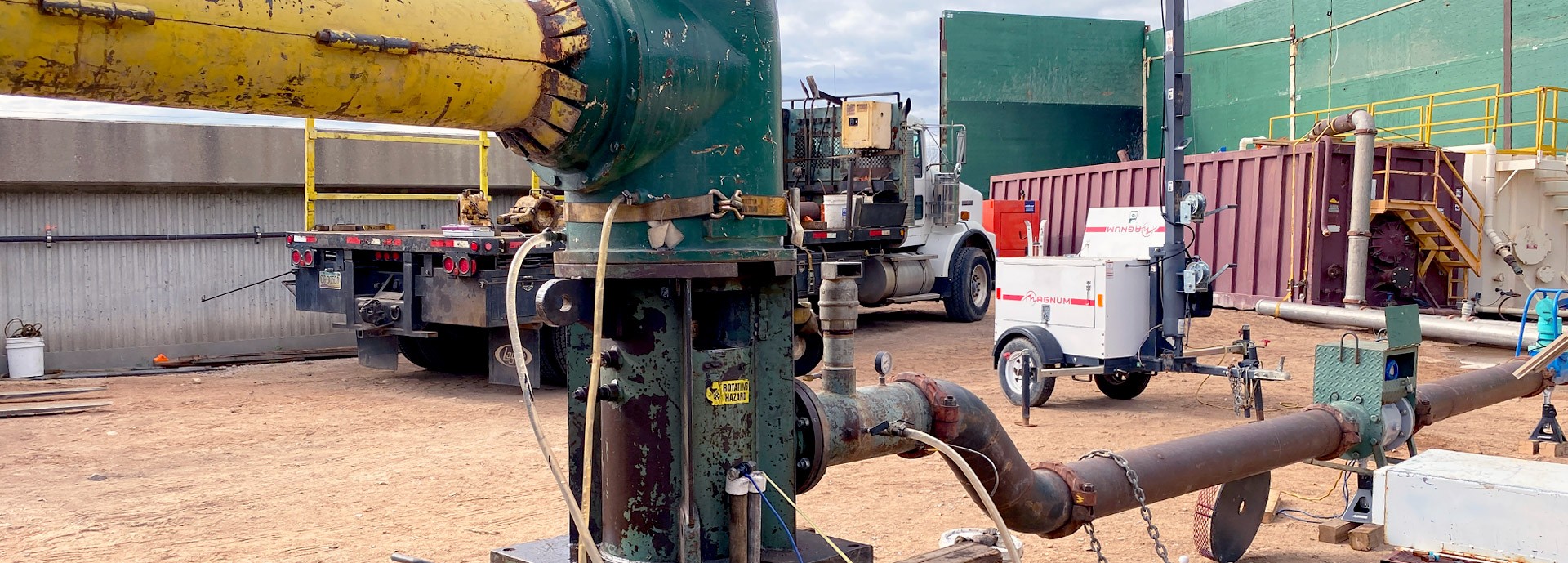 close up of pipes and equipment at well site