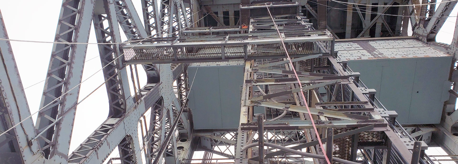 close up of steel girders on bridge elevator shaft