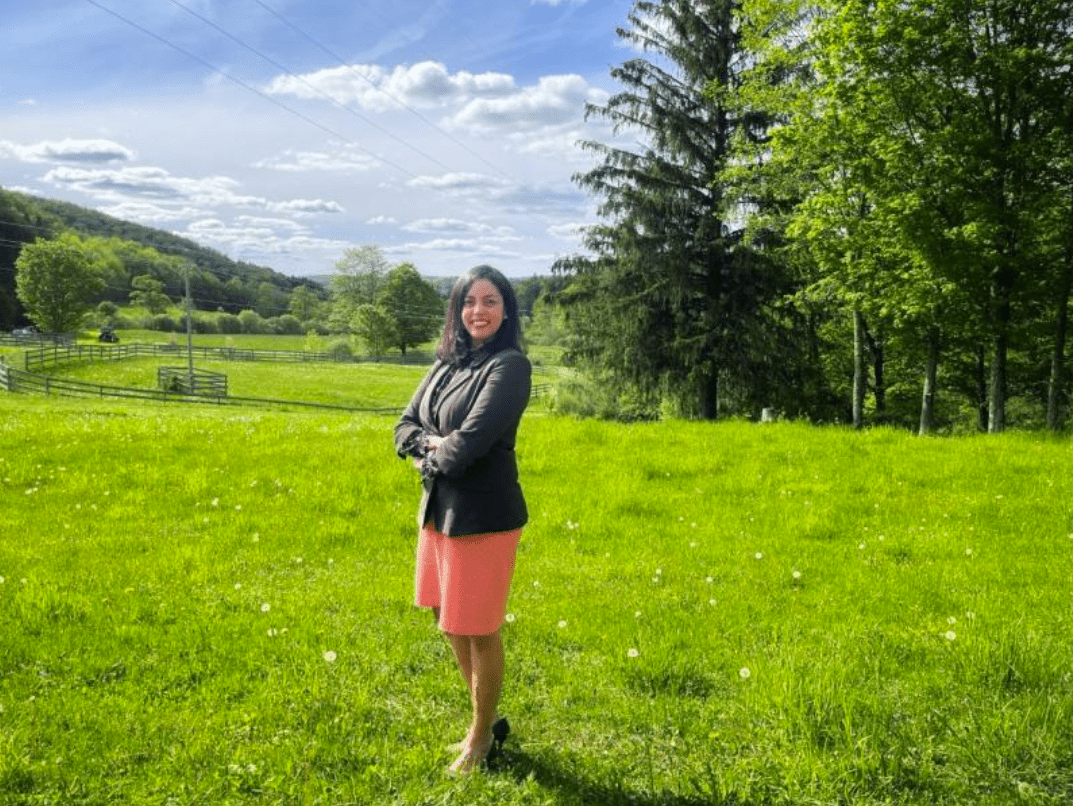 olga standing in grassy field