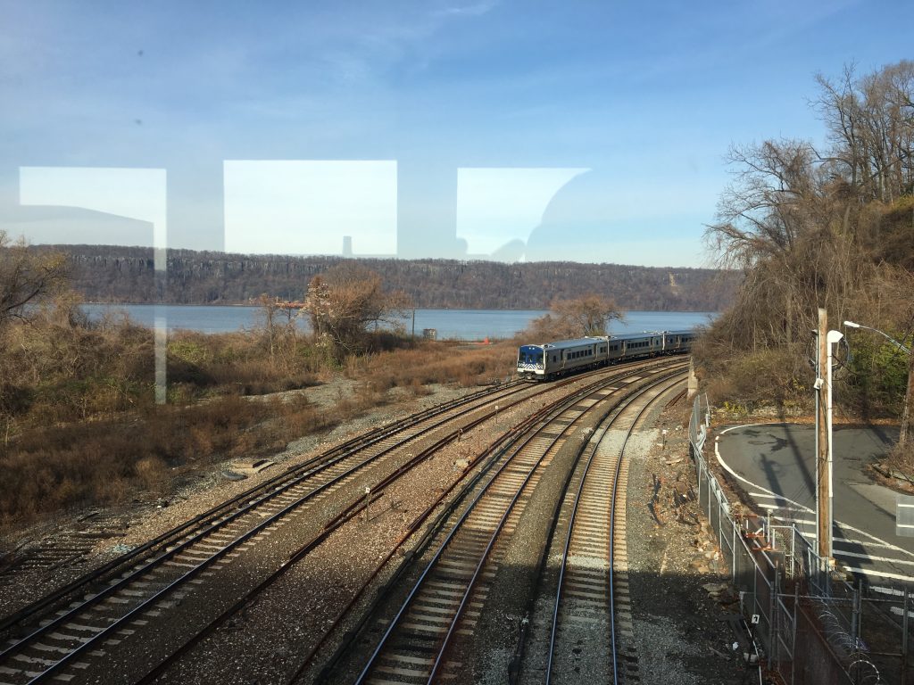 view of train tracks by water