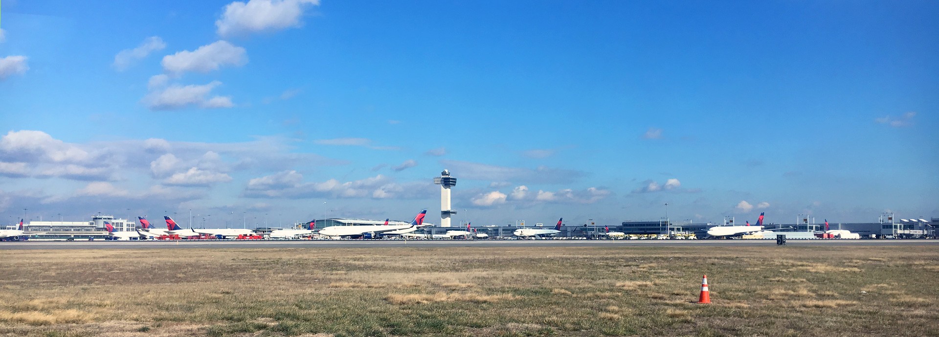 distant view of jfk airport with planes on runway