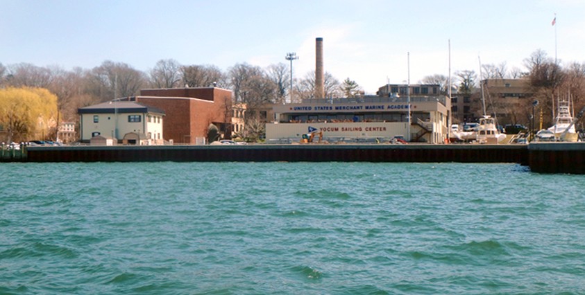 view from water of merchant marine academy building