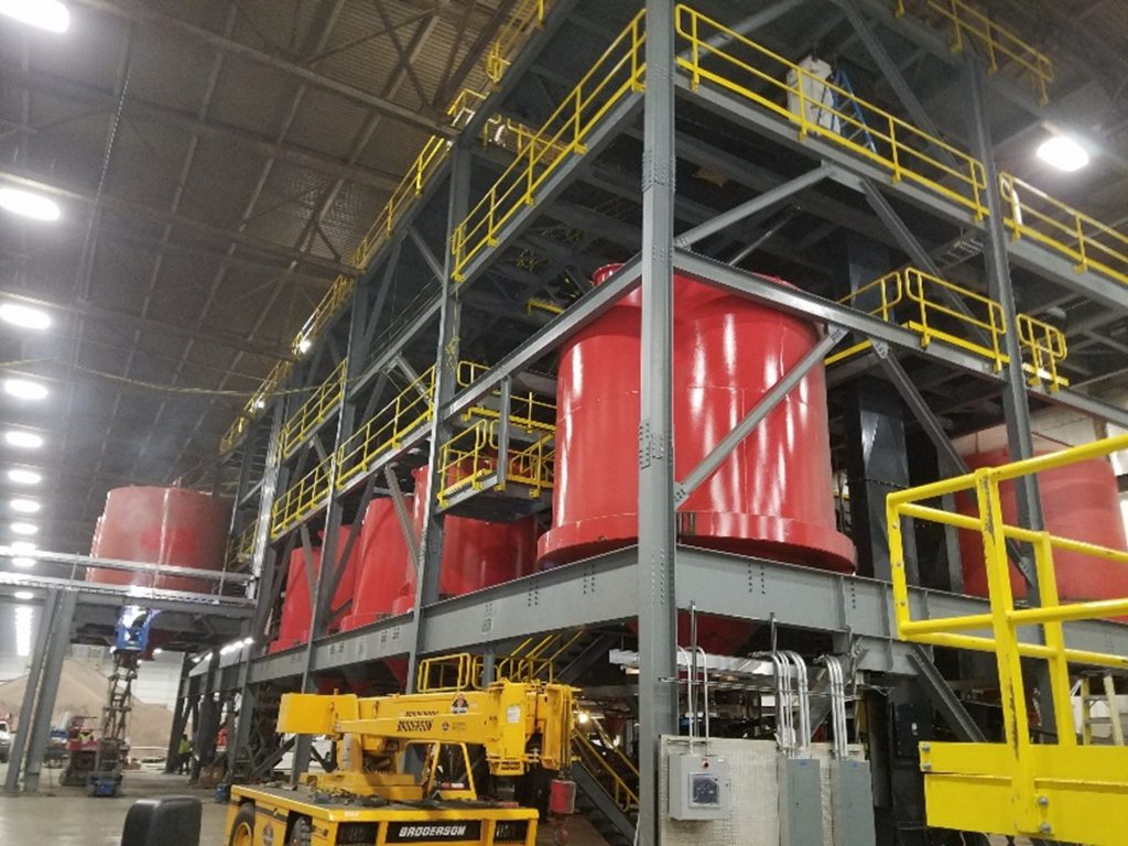 red drums in large steel shelves