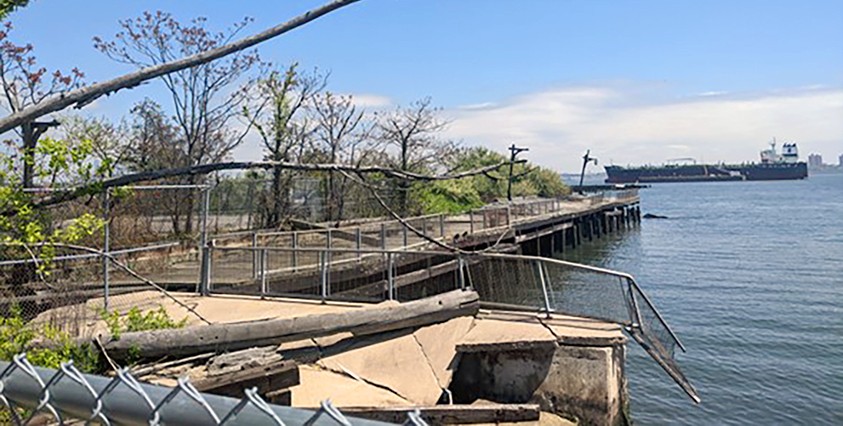 closeup view of esplanade with broken fence