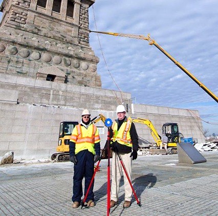 2 surveyors with equipment on site at statue of liberty