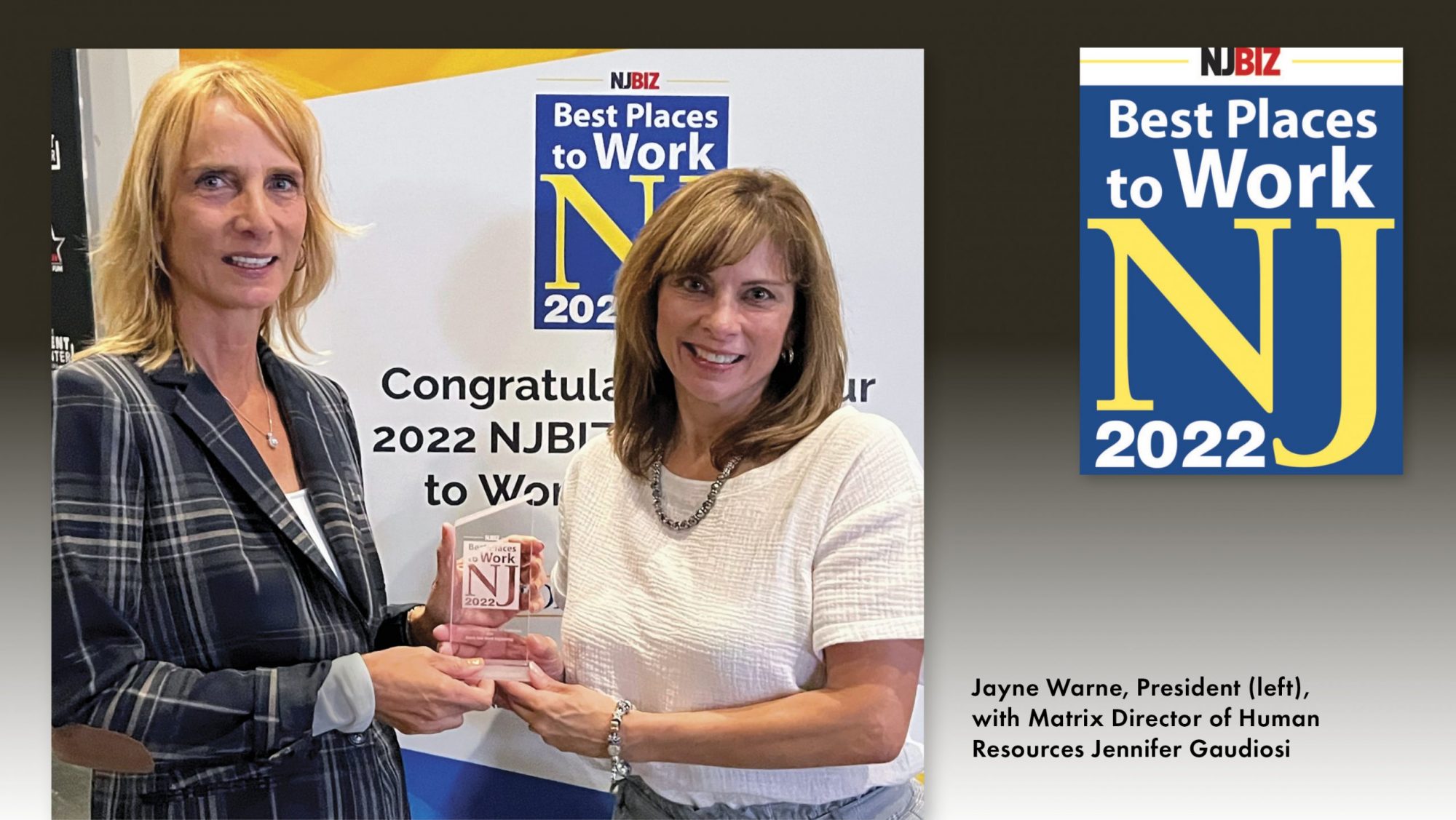 jayne warner and jennifer gaudiosi holding p glass award in front of njbiz best places to work logo