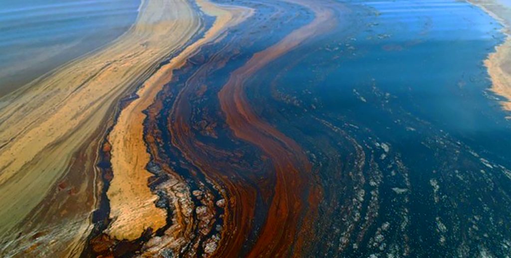 close up of oil slick on water in gulf